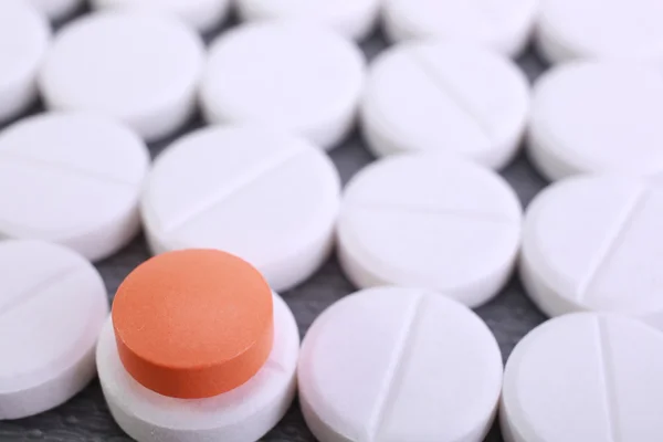 Red and white pill capsules pile — Stock Photo, Image