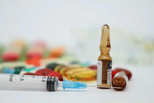 A pile of colorful medications tablets - medical background — Stock Photo, Image