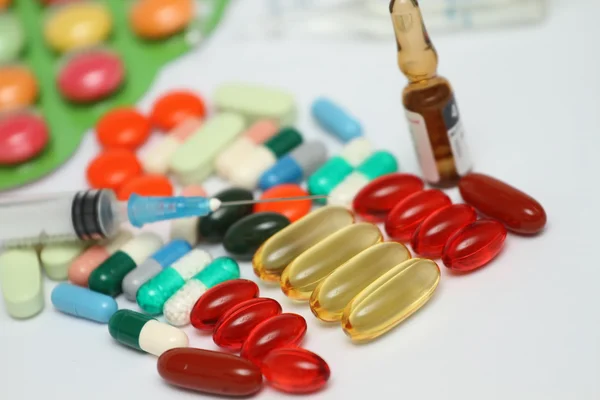 A pile of colorful medications tablets - medical background — Stock Photo, Image