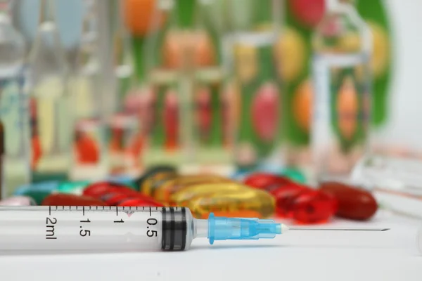 Red and white pill capsules pile — Stock Photo, Image