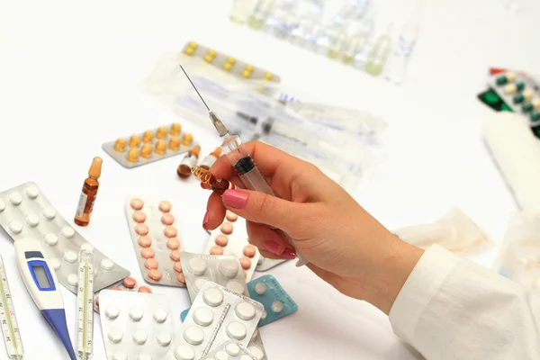 Medical bottles and pills on shelf — Stock Photo, Image