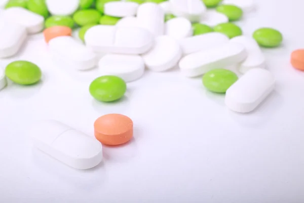 Stack of different pills isolated on white background — Stock Photo, Image