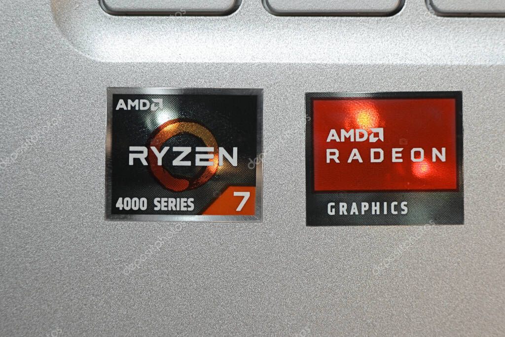 New York, NY - March 16, 2021: AMD RYZEN 7 4000 series CPU and AMD RADEON graphic card stickers on a silver laptop.