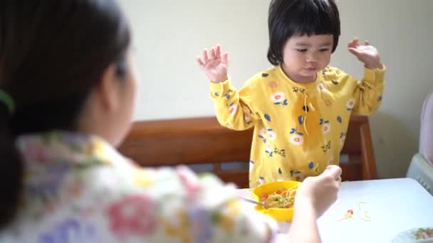 Cute Asian Baby Eating Spaghetti Table — Stock Video