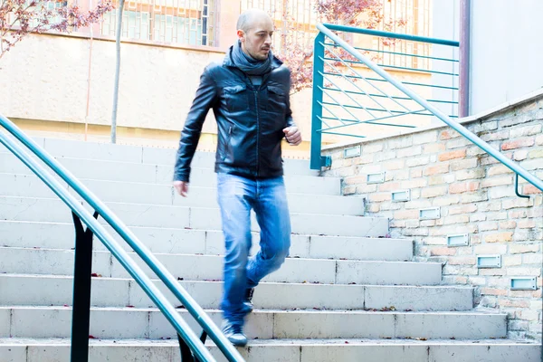 Boy going down the stairs in a hurry — Stock Photo, Image