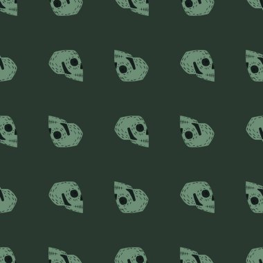 Karalama elle çizilmiş kafatası siluetleri ile korkunç, pürüzsüz desen. Yeşil arka plan. Stok çizimi. Tekstil, kumaş, hediye paketi, duvar kağıtları için vektör tasarımı.