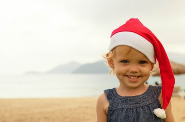 Sevimli kız tropicals Santa şapka