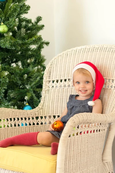 Little girl posing near the christmas tree — Stock Photo, Image