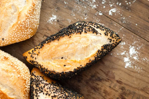 Bread with  sesame on a board — Stock Photo, Image