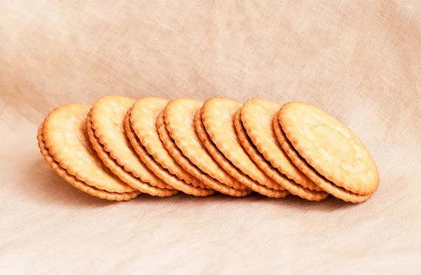 Biscoitos doces sobre fundo têxtil — Fotografia de Stock