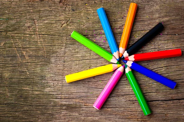 Bright pencils on wooden background — Stock Photo, Image