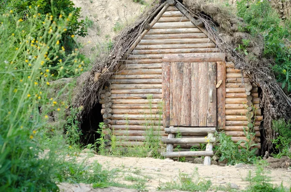 Old solid log cabin shelter hidden  in the forest Royalty Free Stock Photos