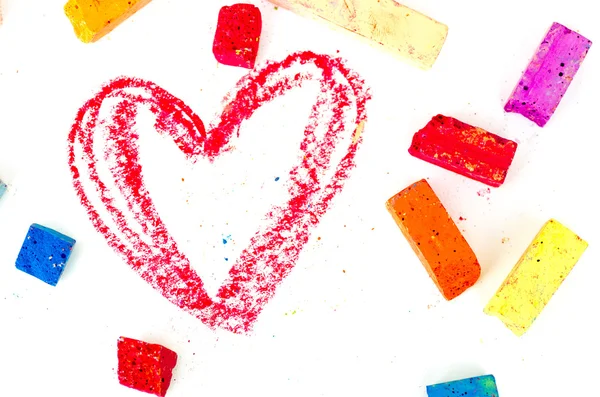 Bright pieces of chalk with the read heart drawn on white — Stock Photo, Image