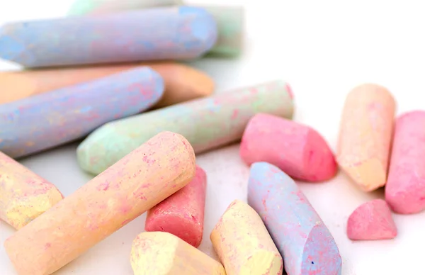 Bright pieces of chalk on white background — Stock Photo, Image