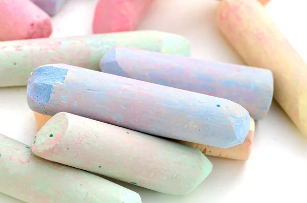 Bright pieces of chalk on white background — Stock Photo, Image