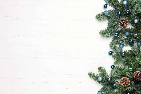 stock image Christmas, New Year white wooden background with fir tree branches