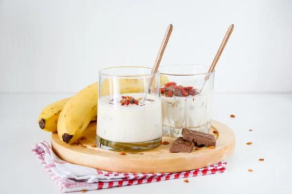 Healthy homemade breakfast: yogurt, granola, bananas and goji berries