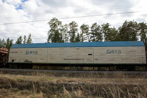 Refrigerated car. Refrigerated car as part of a freight train on rails.