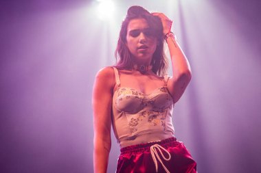 Dua-Lipa performing on stage during  music festival    clipart