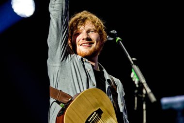 Ed Sheeran performing on stage during  music festival 