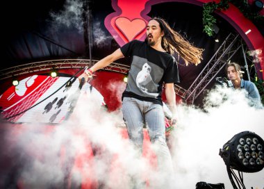 Steve Aoki performing on stage during music concert    