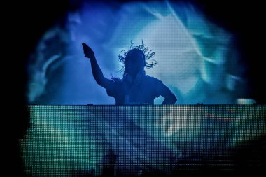 Skrillex performing on stage during  music concert
