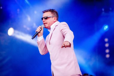 Madness performing on stage during  music concert   clipart