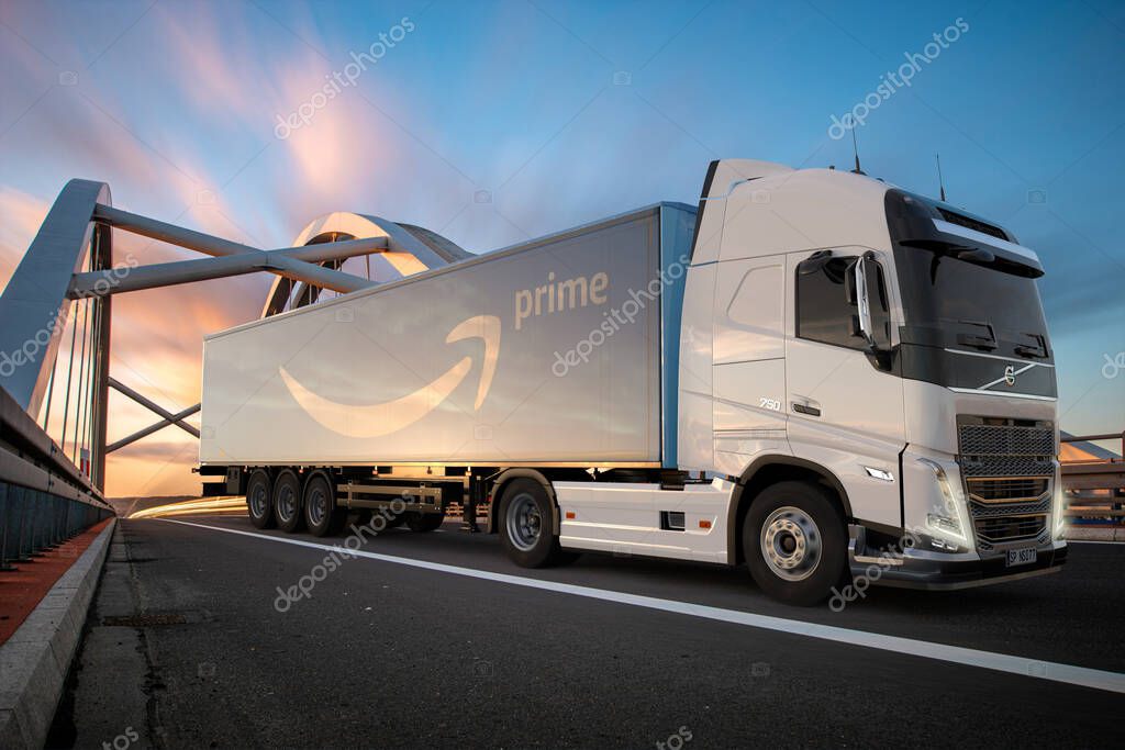 Volvo truck with Amazon Prime logo trailer on the road