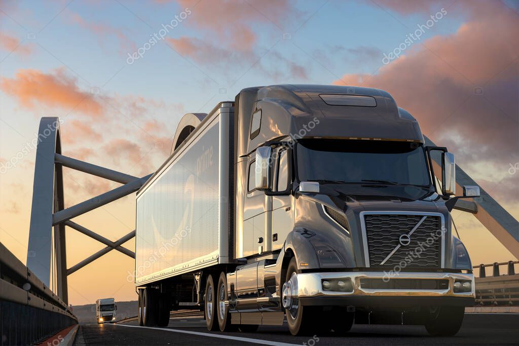 Volvo truck with a trailer bearing the Amazon logo