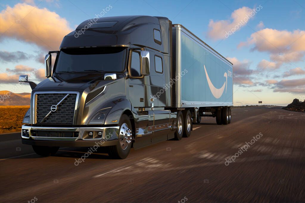Volvo truck with a trailer bearing the Amazon logo