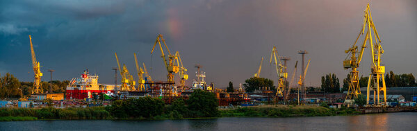 Panoramic view of Szczecin shipyards during a passing evening storm