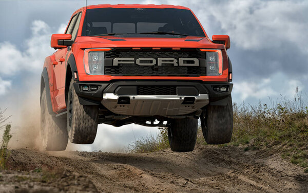 New Ford F-150 Raptor during fast driving in extreme wilderness