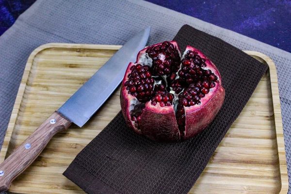 Open Pomegranate Fruit Divided Five Parts Held Together Napkin Cloth — Stock Photo, Image