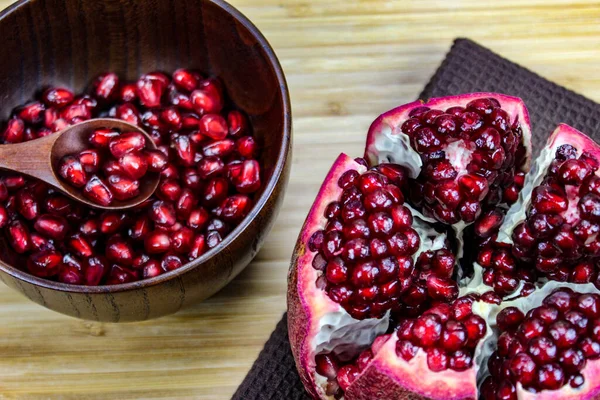 Pomegranate Seeds Wooden Spoon Bowl Whole Ripe Pomegranate Open Wooden — Stock Photo, Image