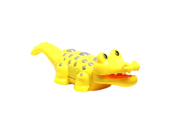 Brinquedo de crocodilo amarelo em um fundo branco — Fotografia de Stock