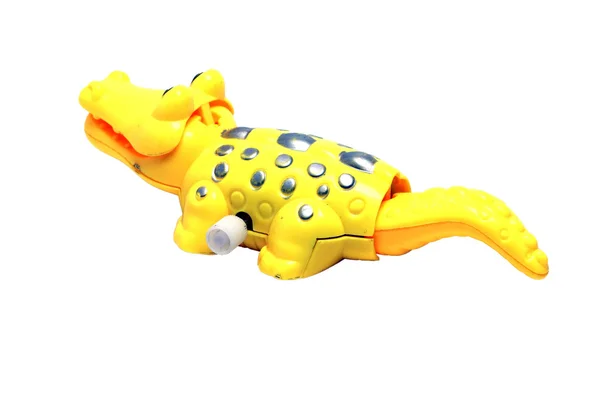 Beyaz zemin üzerine sarı timsah oyuncak — Stok fotoğraf