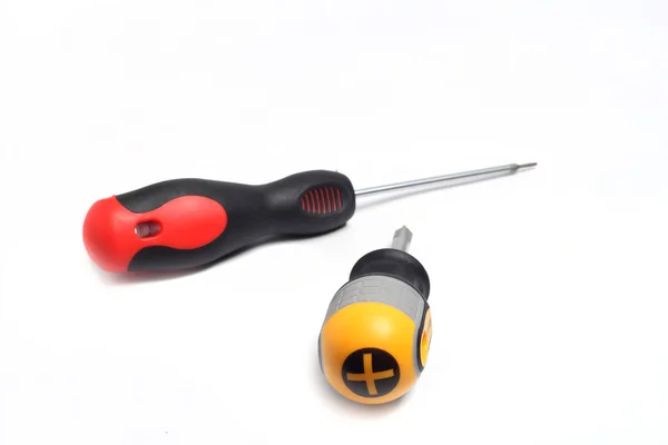 Two different screwdrivers on a white background — 图库照片