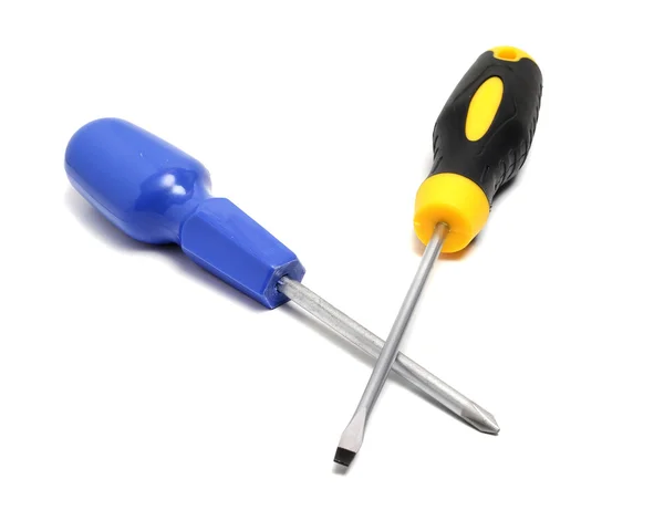 Two screwdrivers on a white background cross and direct — Stock Photo, Image