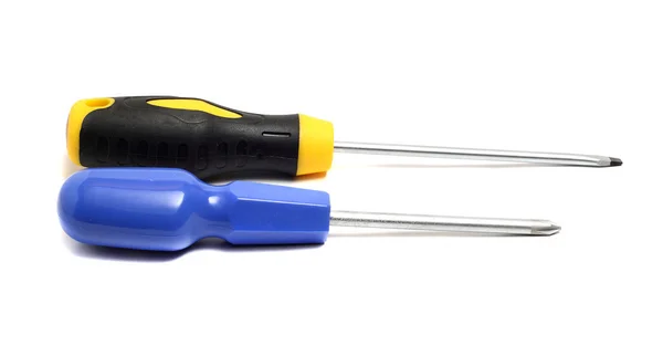 Two screwdrivers on a white background cross and direct — Stock Photo, Image