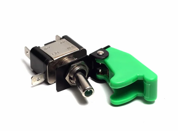 Interruptor eléctrico con un fusible verde sobre un fondo blanco —  Fotos de Stock
