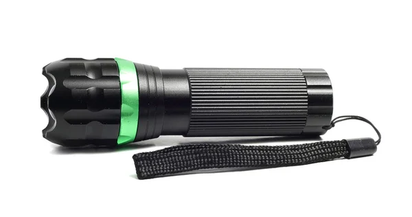 Small black flashlight on a white background — Stock Photo, Image