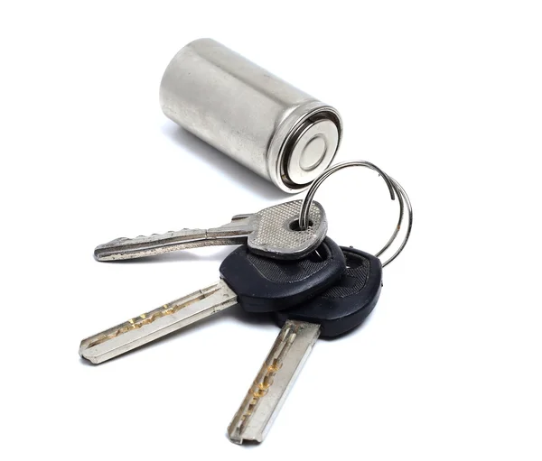 Bunch of old keys and battery on a white — Stock Photo, Image