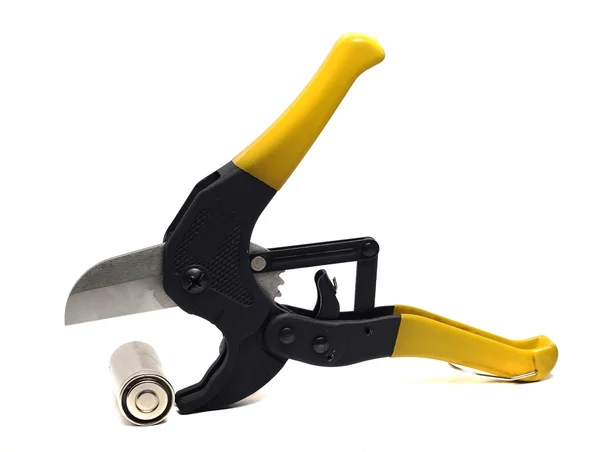 Large pliers for pipes and battery on a white — Stock Photo, Image