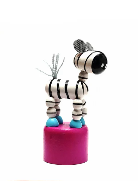 Kleine houten speelgoed zebra op een voetstuk — Stockfoto