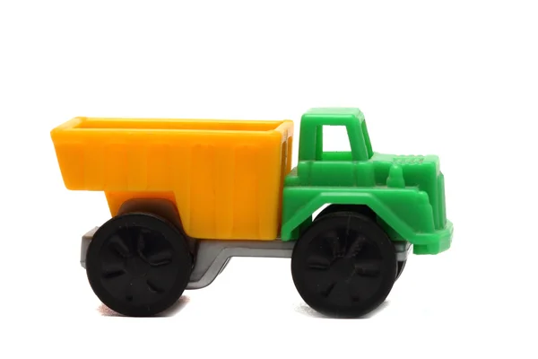 Colorido camión de juguete sobre un fondo blanco de cerca — Foto de Stock