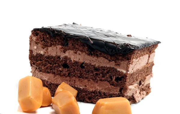 Kleiner Schokoladenkuchen und Butterscotch isoliert auf weißem Backblech — Stockfoto