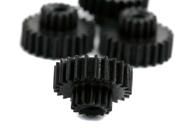 Small gears photographed close up on a white background — Stock Photo, Image