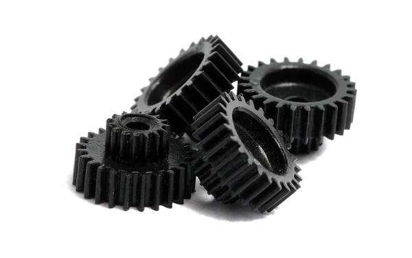 Several small gears photographed close up on a white background — Stock Photo, Image