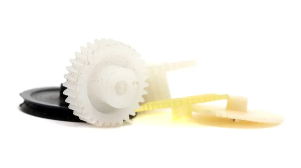 Small dirty plastic gear the background of other — Stock Photo, Image
