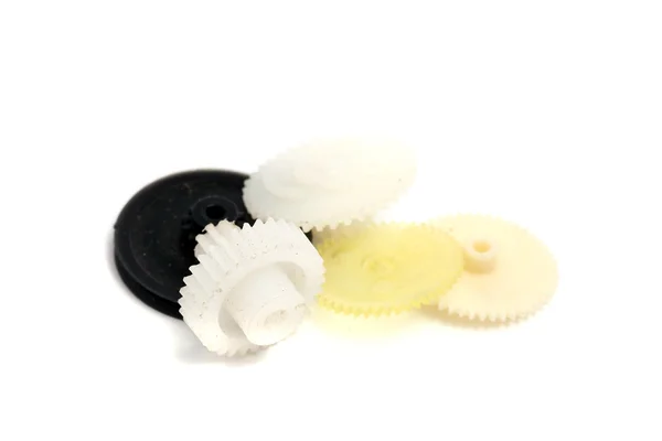 Small dirty plastic gear the background of other — Stock Photo, Image